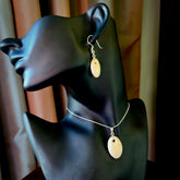 Hand carved woolly mammoth tusk earrings and matching pendant